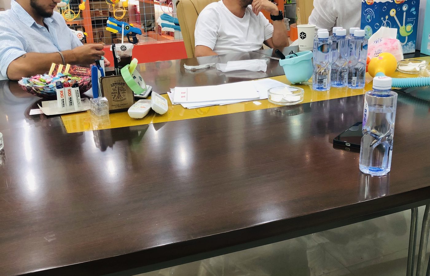 Buyers reviewing toy samples across the showroom table